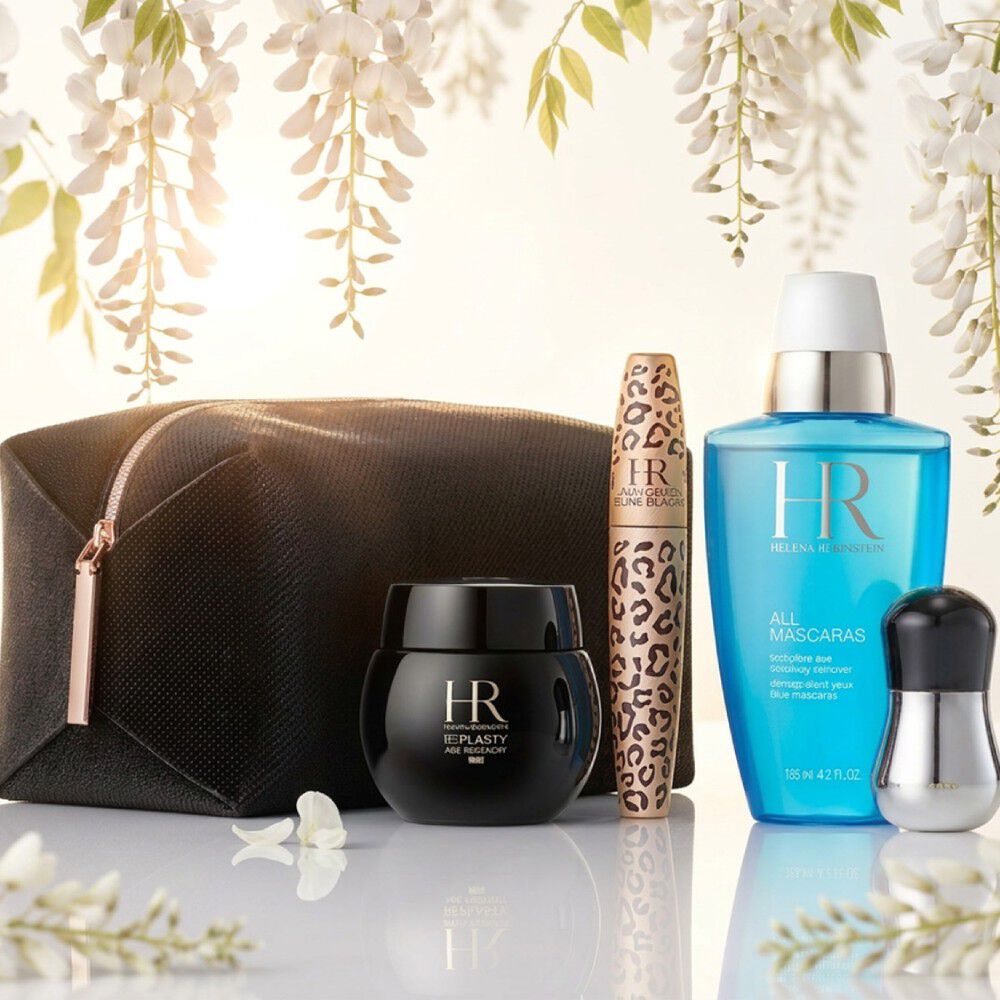 Produits Helena Rubinstein sous des glycines blanches.​