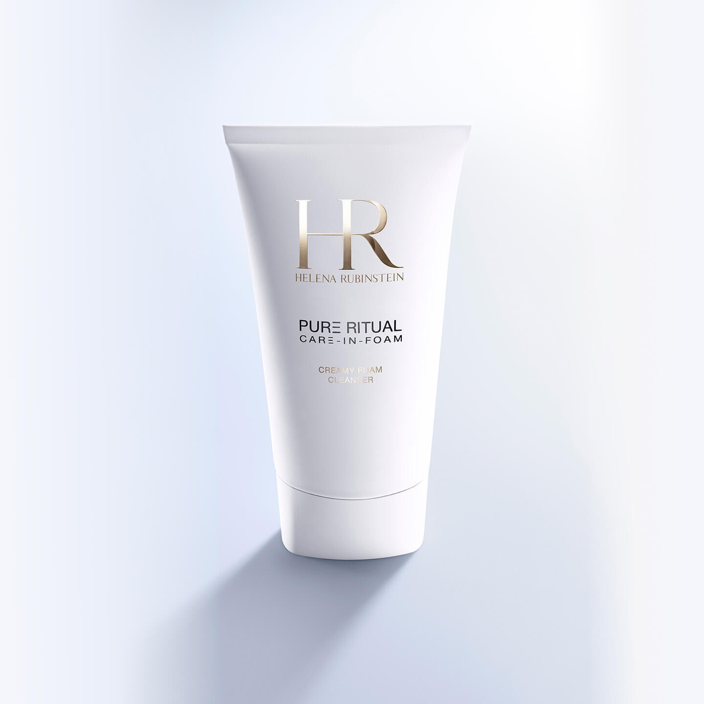 Vue de face du flacon de Pure Ritual Care-in-Foam d Helena Rubinstein sur un fond bleu.