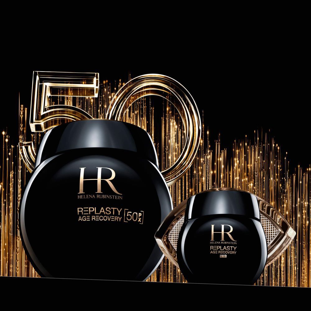 Deux pots noirs de creme "Helena Rubinstein Re-Plasty", l'un rond, l'autre avec un contour dore, sur fond noir avec des elements lumineux dores et le chiffre "50".