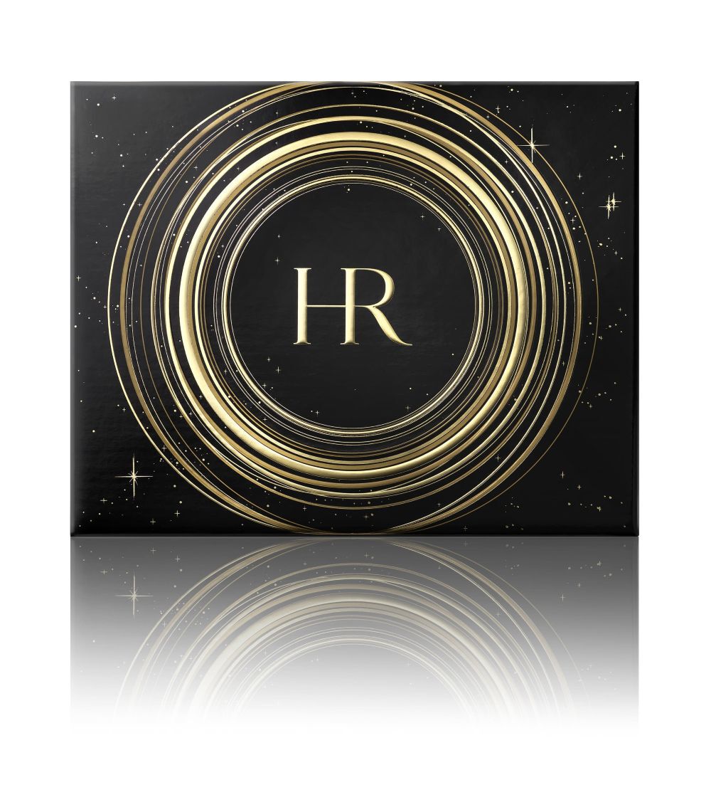 Coffret cadeau noir et dore ouvert, presentant quatre produits Helena Rubinstein "Re-Plasty" etiquetes (serum, creme de nuit, creme de jour) et le logo "HR", sur fond blanc.